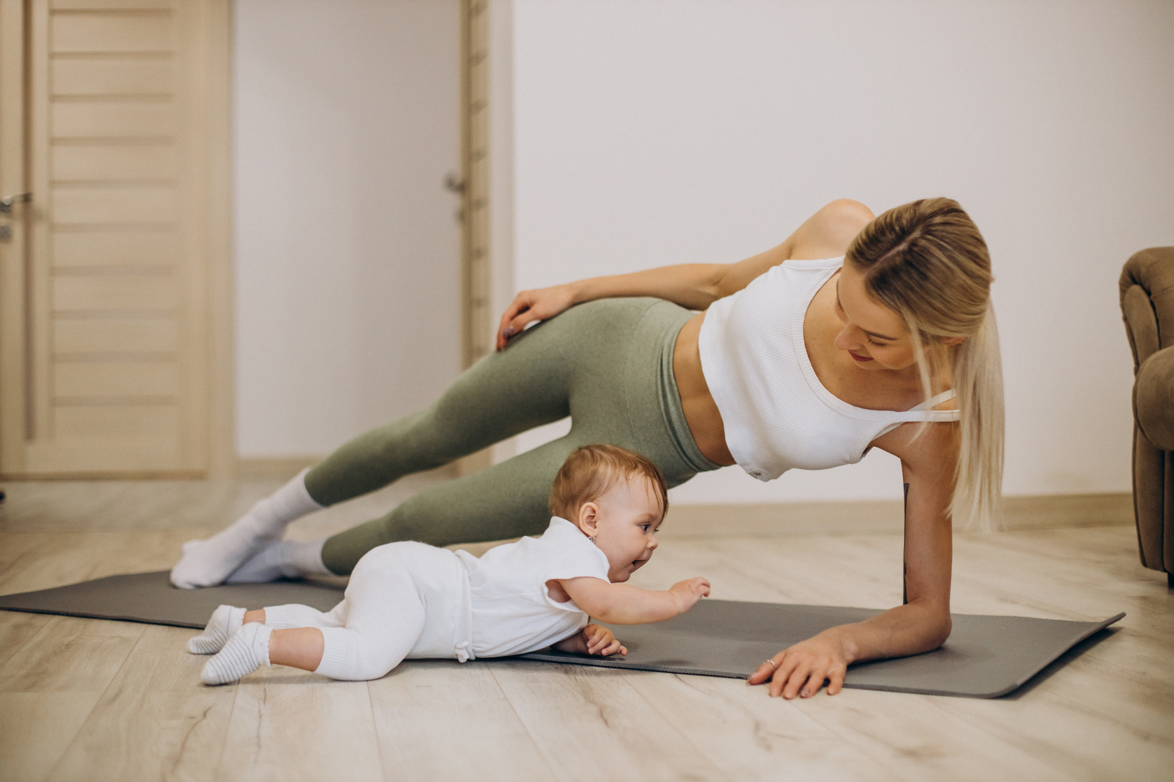 Mother exercising with a baby